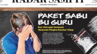 Diana Susilawati (46) hanya bisa tertunduk malu saat digiring aparat kepolisian